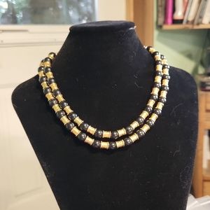 Double strand black glass and metal beads necklace. Shortest strand is 12" long.